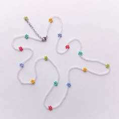 This Daisy beaded belly chain is handwoven in iridescent clear color and rainbow flowers with silver stainless steel clasp and extra chain. The chain is made to order especially for you in different lengths, including large PLUS sizes. If you want to make a personal order (other length, clasp color) feel free to contact me.Please choose the length you need (the length in variations is indicated without additional chain)This waist chain is made of transparent iridescent Czech beads and colorful T Seed Bead Belly Chains, December Fits, Belly Chain Body Jewelry, Beaded Belly Chain, Rainbow Loom Rubber Bands, Bracelets Easy, Y2k Accessories, Bracelets Handmade Diy, Bead Charms Diy