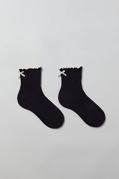 Ribbed ruffle crew socks. Sweet socks in a soft ribbed knit with a ruffled lettuce edge. Finished with a satin bow at the ankle. Features Ribbed ruffle crew socks Ruffle socks with a satin bow Ultra-soft ribbed knit Content + Care 70% Cotton, 28% polyester, 2% spandex Machine wash Imported Size + Fit Crew sock length Fits US women’s shoe size 6–10 | Ribbed Ruffle Crew Sock in Black, Women's at Urban Outfitters Black Socks With Lace Trim For Spring, Socks Ruffle, Ruffle Socks, Ruffled Socks, Crew Sock, Satin Bow, Crew Socks, Lettuce, Ribbed Knit