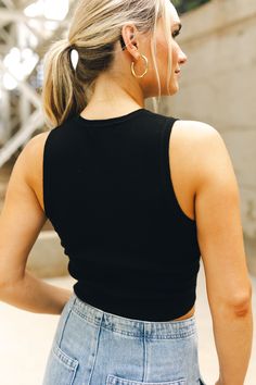 The Elise Sweater Tank sounds like a chic and versatile piece! Here’s a breakdown of its features: Sleeveless Design: Ideal for layering or wearing on its own in warmer weather, making it a versatile addition to your wardrobe. Cropped Style: Offers a modern, on-trend silhouette that pairs well with high-waisted jeans, skirts, or shorts, accentuating the waist and providing a balanced look. Sweater Fabric: Adds a touch of warmth and texture, making it suitable for transitional weather and adding Versatile Fall Tank Top For Day Out, Versatile Tank Top For Fall Day Out, Versatile Tank Top For Fall Layering, Black Cropped Versatile Tank Top, Versatile Black Cropped Tank Top, Versatile Black Ribbed Top, Versatile Black Tank Top For Fall, Trendy Fall Tank Top For Everyday, Versatile Cotton Crop Top For Layering