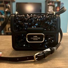 Brand New With The Tags And Absolutely Stunning Describes This Authentic Coach Black Leather Glitter Sequined Morgan Square Crossbody Bag Purse. Color Is Gold & Black Sequins And Smooth Leather Inside Zip And Multifunction Pockets Snap Closure, Fabric Lining Outside Open Pocket Adjustable Strap With 21 1/2" Drop For Crossbody Wear Measures: 7 1/4" (L) X 5 3/4" (H) X 2 1/4" (W) Designer Evening Bag With Sequins, Designer Evening Bags With Sequins, Designer Sequin Bags For Formal Occasions, Designer Sequined Evening Bags, Luxury Black Sequined Bags, Luxury Glitter Bags For Everyday Use, Luxury Glitter Rectangular Bag, Coach Leather Party Bags, Rectangular Shoulder Bag With Sequins For Night Out