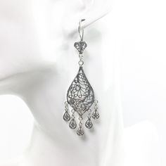 Handmade 925 Sterling Silver Artisan Crafted Filigree Teardrop Chandelier Earrings  Material: 925 Solid Sterling Silver, 925 Stamped Earrings Length: 3 inches Earrings Width: 0.75 inches Closure: Ear wire with safety catch Finishing: Oxidized and Polished Comes with a gift pouch and box. Free Domestic Shipping We hope that you enjoy our exclusive artisan handcrafted jewelry. Ornate Sterling Silver Chandelier Earrings, Silver Drop Chandelier Earrings, Sterling Silver Nickel Free Teardrop Earrings For Wedding, Classic Teardrop Chandelier Earrings, Elegant Drop Chandelier Earrings, Elegant Sterling Silver Drop Earrings With Matching Set, Elegant Long Drop Silver Earrings, Silver Dangle Chandelier Earrings With Intricate Design, Bohemian Sterling Silver Teardrop Chandelier Earrings