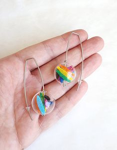 Unusual rainbow earrings made of stainless steel earring hooks, nylon mesh and glass ball.    Earrings length: 5.5 cm / 2.25 in Package will be shipped out as soon as I possibly can which is usually 3 - 5 days after the purchase.  Don't hesitate to contact me if you have any question. Thanks for stopping by and don't forget to check my other items.  Join Pevalek Jewellery at https://www.facebook.com/PevalekJewellery Modern Rainbow, Contemporary Earrings, Unusual Earrings, Ball Earrings, Rainbow Earrings, Earrings Minimalist, Earring Hooks, Earrings Statement, Etsy Earrings Dangle