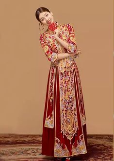 Indulge in a traditional Chinese bridal gown with this stunning 2-piece qun kwa set, adorned with intricate embroidery in gold, silver, and white. The embroideries of dragon and phoenix, representing eternal love, are carefully placed throughout the jacket and skirt. This celestial couple is the embodiment of matrimonial bliss. Perfect for a traditional Chinese wedding or tea ceremony. The qun kwa set come with 2 options: With crystals/hot drill decoration or no crystal/hot drill . Size availabl Qun Kwa, Traditional Chinese Wedding, Qipao Cheongsam, Wedding Essentials, Chinese Wedding, Intricate Embroidery, Mens Essentials, Eternal Love, Tea Ceremony