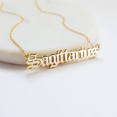 Beautiful and lovely Sagittarius script letter pendent necklace in gold color. Soft and warm. Your item will ship in a gift box. Please feel free to contact me if you have any question. ♥ Sagittarius (Birth date: November 22 - December 21) ♥ Chain length 14"- 20" ♥ Pendent  3/8" x 1 7/8" ♥ Gold plated over brass  ♥  See more Rudiana Accessories  Rudiana.etsy.com Letter Pendent, Sagittarius Pendant, Script Necklace, 22 November, 22 December, Constellation Necklace, Zodiac Necklace, December 21, Zodiac Jewelry