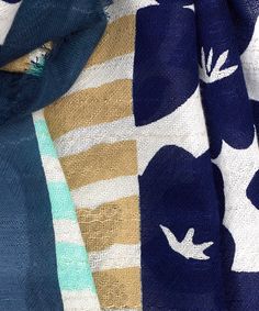 Forget what you know about flowery scarfs — this graphic wrap is a forget-me-not. It's a lightweight staple that makes a perfect warm-weather signature. Dimensions: 30" X 80" Fabrication: 76% cotton, 24% linen Casual Patterned Scarves For Summer, Blue Cotton Summer Scarves, Blue Scarves For Spring, One Size, Blue One Size Scarves For Spring, One Size Blue Scarves For Spring, Spring Floral Print Beach Scarves, Spring Green Cotton Scarves, White Spring Scarves For Vacation, Green Cotton Scarves For Spring