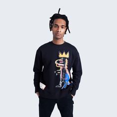 Stay cozy and comfy with this Basquiat sweatshirt! This medium weight fleece crewneck features Basquiat’s Pez Dispenser across the front—with the dinosaur’s tail extending to the back side of the crewneck. The bottom left of the crewneck features a sewn-in woven tag printed with Basquiat’s handwritten text from his famed notebook pages. Style this cozy sweatshit with the matching Basquiat Pez Dispenser Sweatpants to complete the look! Machine wash cold with like colors; Do not bleach; Do not iro Fleece Crew Neck Sweatshirt For Streetwear, Streetwear Fleece Crew Neck Sweater, Fleece Crew Neck Sweater For Streetwear, Crew Neck Fleece Sweater For Streetwear, Urban Crew Neck Fleece Sweater, Urban Fleece Crew Neck Sweater, French Terry Crew Sweater For Streetwear, French Terry Sweater With Crew Neck For Streetwear, Graphic Print French Terry Sweater With Crew Neck