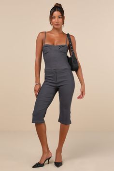 Everyone will envy your oh-so-chic look when you're wearing the Motel Sawil Charcoal Grey Mid-Rise Capri Trouser Pants! Stretchy woven fabric shapes these on-trend pants that have a mid-rise fit with a banded waist and a hidden zip fly with a top clasp closure. Fitted legs continue down to chic, capri-length hems with a slight flare. Pair with the matching top for a complete look! Fit: This garment fits true to size. Length: Knee Length. Size medium Inseam: 17.50 Front Rise: 9.00 Waist: Fitted - Trend Pants, Capri Set, Capri Trousers, Cute Fit, Cami Crop Top, Slingbacks, Matching Top, Bottom Clothes, Trouser Pants