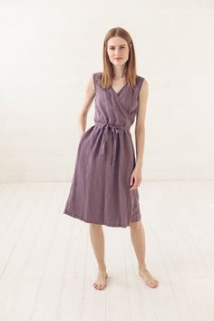 "DETAILS * Linen wrap dress with stylish long belt * Two side pockets for your comfort * Sleeveless light dress make feel fresh in all warm days * Made from soft wash medium weight (185 g) 100 % European linen fabric * Height of the model is 177 cm (5' 8\") and she is wearing size XS/S dress in violet ash color * The full length of linen dress is +/- 110 cm/ 43.3\" * Please choose desired color and size on the right * Product number: D32 CARE LABEL * machine wash gentle (40 C/104 F) * dry gentle Casual Sleeveless Wrap Dress For Summer, Casual Belted Knee-length Wrap Dress, Casual Wrap Dress With Tie Waist, Casual Sleeveless V-neck Dress With Tie Waist, Casual Sleeveless Wrap Dress For Beach, Casual Sleeveless Beach Wrap Dress, Casual Wrap Midi Dress With Tie Waist, Sleeveless Linen Belted Dress, Casual Knee-length Wrap Dress With Tie Waist