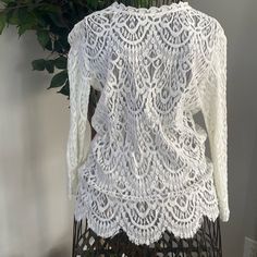 Nwt! Beautiful White Laced Blouse / Long Sleeve. Never Worn Elegant Crochet Top For Spring Day Out, White Feminine Crochet Top For Brunch, Elegant Crochet Top With Lace Trim For Brunch, White Stretch Lace Top For Layering, Elegant Long Sleeve Crochet Top For Brunch, Elegant White V-neck Crochet Top, Chic White Long Sleeve Crochet Top, White Stretch Blouse For Layering, Elegant Crochet Top With Lace Trim For Day Out