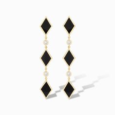 Turn heads with our Diamonds Do Sparkle Statement Earrings in striking black onyx. These captivating drop earrings blend timeless sophistication with a modern edge, featuring a series of playful diamond shapes interspersed with shimmering cubic zirconia accents. The sleek black and gold design exudes elegance, while the pop of sparkle adds a touch of glamour to any ensemble. Perfect for those who love to make a statement, these earrings will elevate both everyday looks and evening wear. Embrace Black Beaded Jewelry, Black Onyx Stone, Sparkle Earrings, Happy Vibes, Black Earrings, Diamond Shaped, Onyx Stone, Drop Earring, Diamond Shape