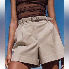 Shorts With A Mid Waist With Faux Leather Belt And Front Pleats. Front Pockets And Back False Welt Pockets. Front Zip, Inner Button And Metal Hook Closure. Color: Light Camel Trendy Beige Wide-leg Shorts, Chic Bermuda Shorts With Belt Loops, Chic Short Pants With Belt Loops, Trendy Beige Workwear Shorts, Trendy Beige Shorts For Workwear, Chic Short Leg Pants With Belt Loops, Trendy Summer Bottoms With Belt Loops, Summer Shorts With Belt Loops, Zara Bottoms With Built-in Shorts