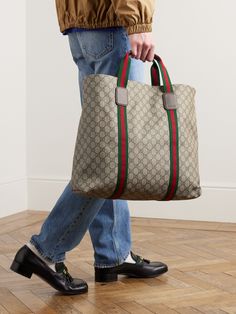 The monogram decorating Gucci's 'GG Supreme' coated-canvas is one of fashion's most recognisable hallmarks. Crafted in Italy, this tote bag is made from monogrammed 'Tender' canvas trimmed with signature red and green webbing. Store your essentials in the handy internal zip pocket. Luxury Bag Men, Gucci Luggage, Beige Tote Bag, Man Clothes, Beige Tote, Gucci Crossbody Bag, Shopping Totes, Gucci Tote Bag, Men's Totes