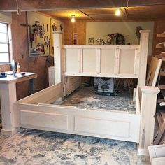 an unfinished bed frame in a garage