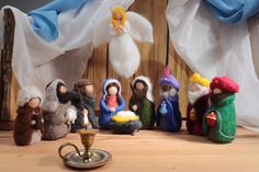 a group of small figurines sitting on top of a wooden table