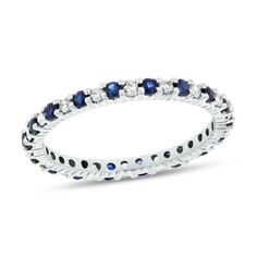 a white gold ring with blue sapphire and diamonds