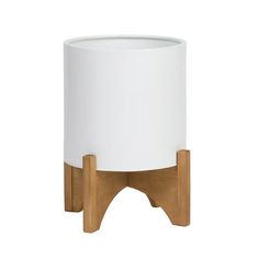 a white and wood pot with a wooden stand on the bottom that holds a cup