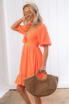 Get ready to make a lasting impression with the Nour Orange Creamsicle Mini Dress. This dress is all about fun and flirty vibes with its vibrant creamsicle hue and irresistible sweetheart neckline. The flowy and free silhouette adds an alluring appeal, while the smocked back ensures a comfortable fit. With front bow detailing, this dress adds a charming touch to your ensemble. Style it with wedges and statement jewelry for a trendy and complete look that is perfect for any occasion. Whether it's Summer Mini Dress With Sweetheart Neckline For Brunch, Summer Midi Dress With Sweetheart Neckline For Brunch, Trendy Mini Dress With Sweetheart Neckline For Spring, Chic Summer Midi Dress With Sweetheart Neckline, Summer Mini Dress With Sweetheart Neckline, Trendy Summer Dresses With Sweetheart Neckline, Summer Vacation Mini Dress With Sweetheart Neckline, Orange Knee-length Mini Dress For Summer, Summer Midi Sundress With Sweetheart Neckline