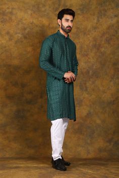 BLUESAANCHI MEN'S DARK GREEN ZARI KURTA SET   Elevate your ethnic wardrobe with the Bluesaanchi Men's Dark Green Zari Kurta Set. Crafted with elegance and attention to detail, this kurta set is perfect for festive occasions, family gatherings, or cultural celebrations. The intricate zari work adds a touch of sophistication, making it a must-have for every modern man's collection.  Key Features  Elegant dark green color  Intricate zari embroidery for a luxurious look  Comfortable and breathable fabric  Includes matching kurta and bottoms  Perfect for festive and formal occasions   Specifications  Brand: Bluesaanchi  Color: Dark Green  Style: Kurta Set  Available Sizes: S, M, L, XL, XXL  Pattern: Zari Work   Material & Care  Material: 100% Cotton with Zari Embroidery  Care Instructions: Dry Green Straight Kurta Bandhgala With Dabka, Green Straight Kurta Bandhgala With Dabka Details, Green Long Sleeve Kurta For Transitional Season, Designer Green Cotton Sherwani, Transitional Green Cotton Sherwani, Green Cotton Bandhgala For Eid, Festive Green Handloom Kurta, Traditional Green Kurta With Self Design, Green Kurta For Puja And Navratri