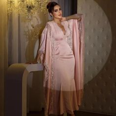 Elevate your bedtime routine with our luxurious Nightgown Juliane. This 2-piece set includes a delicate lace nightgown and ankle-length bathrobe, perfect for lounging in style. The soft pink color adds a touch of romance, making it ideal for brides. Enjoy ultimate comfort and elegance with our Nightgown Juliane. Feminine V-neck Evening Nightgown, Elegant Pink Sleepwear For Loungewear, Elegant Pink Nightgown For Loungewear, Elegant Pink Evening Sleepwear, Feminine V-neck Nightgown For Evening, Elegant Pink Nightgown, Elegant Pink Sleepwear For Wedding Night, Elegant Pink Long Sleeve Sleepwear, Elegant Long Sleeve Evening Nightgown