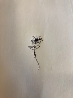 a drawing of a flower on white paper