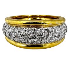 This smaller scale dome ring is fashioned in 18K yellow gold and is pave set with diamonds across the top. Diamonds are bordered on each side by high polish gold edges. It can be worn as a casual right hand ring, or as a wedding band, if so desired. Measures just over 5/16 of an inch at the widest point in front and tapers down to just over 3/16 of an inch at the rear. Brilliant cut diamonds weigh 1.04ct total of overall H/I color and SI1 clarity. The sizing spring inside allows for minor adjust Antique Jewelry Rings, Right Hand Ring, Modernist Ring, Dome Ring, Right Hand Rings, Hand Ring, Ring Pictures, Pave Ring, 18k Yellow Gold Ring