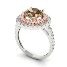 a ring with an oval shaped brown and white diamond surrounded by smaller round diamonds on the sides