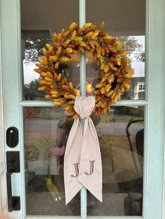 a wreath is hanging on the front door