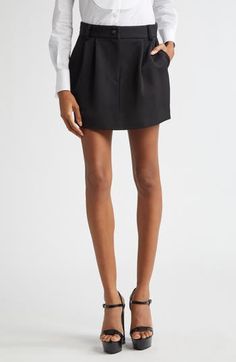 This runway-featured gabardine skirt takes inspiration from the sartorial elegance of pleated tuxedo pants and mingles it with the seductive lines of the leg you can only get from a mini length. Zip fly with button closure Front slant pockets; back button-welt pockets Unlined 90% virgin wool, 8% silk, 2% polyester Dry clean Made in Italy Designer Clothing Elegant Fitted Skirt For Semi-formal Occasions, Pleated Waist Mini Skirt For Workwear And Fall Season, Formal Pleated Mini Skirt, Pleated Waist Mini Skirt For Workwear In Fall, Pleated Waist Mini Skirt For Work And Fall, Formal Mini Skirt With Pleated Waist, Classic Mini Skirt With Accordion Pleats, Classic Mini Skirt With Pleated Waist, Elegant Short Length Pleated Skirt