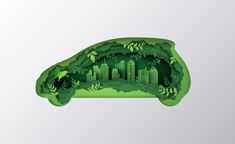 an image of a green car with trees and buildings cut out of the top, on a white background