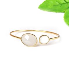 White Onyx and White Moonstone Bangle, Silver Bangle Jewelry, Gold Plated Bangle, Onyx Bangle Jewelry, Gemstone Bangle, Sale Silver Bangle Description : Metal: 925 Sterling Silver Gemstone: White Onyx and White Moonstone Weight: 8.23 Gram Approx Stone Size: 16 x 12 MM Approx, 9 x 7 MM Approx Handmade Items **Made To Order** Delivery Time:- Once Item is shipped parcel will be delivered to you in 2-4 weeks. C U S T O M I Z E O R D E R All jewelry is made with solid 925 sterling silver. If you want White Moonstone Bangle Bracelet, White Moonstone Bangle, Adjustable White Gemstone Cuff Bracelet, Aqua Ring, Silver Cuff Bangle, Silver Rings Simple, Bangle Silver, Gemstone Bangle, White Onyx