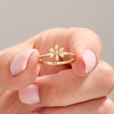 Introducing our 14k Gold Tiny Flower Promise Ring, a charming symbol of love and commitment. This Solid Gold Cute Engagement Ring features a minimalist floral design, making it perfect for everyday wear. Handcrafted with care, this dainty ring is a beautiful expression of elegance and simplicity, making it an ideal choice for any occasion. Ring Details ❥ Gold KT: 14k 18k 10k Solid Gold ❥ Gold Colour Options; Yellow Gold, White Gold, Rose Gold ❥ Band Width: 1.15 mm ❥ Top Width: 7.80x6.90 mm ❥ Thickness: 1.35 mm MORE FROM US More about my shop: https://etsy.me/3mwMnsA Engagement Rings: https://etsy.me/3HLWW58 ESSENTIAL INFORMATION 💎 BRENNMORE pieces are handcrafted by 15-30 years of experienced craftsmen and made to order. 🎁 All pieces come in a special turquoise gift box wrapped beautiful Latest Gold Ring Designs, Plain Gold Ring, Pure Gold Jewellery, Earring Display Stands, Braided Ring, Cute Engagement Rings, Gold Rings Fashion, Gold Ring Designs, Zierlicher Ring