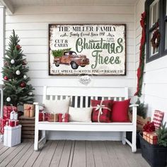 a white bench sitting on top of a wooden floor next to christmas trees and presents