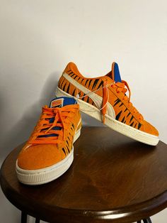 This PUMA Suede x Frosted Flakes Low sneaker is a must-have for any sneaker collector or fan of Tony the Tiger. The shoe features a bright orange color and low-top shaft style, making it perfect for a variety of activities such as cycling, basketball, and skateboarding. It is available in size 6.5 for both men and women. The sneaker is made of suede material and has a PUMA X product line. It also comes with a style code of 388018-01 and was released in 2022. This athletic shoe is suitable for various performance and activities such as golfing, hiking, and walking. Don't miss out on adding this unique and stylish sneaker to your collection! Casual Orange Sneakers For Sports, Orange Mid-top Skate Shoes For Streetwear, Orange Lace-up Sneakers For Jogging, Casual Orange Sneakers With Rubber Sole, Casual Orange Sneakers With Round Toe, Orange Round Toe Casual Sneakers, Casual Orange Mid-top Skate Shoes, Casual Orange High-top Sneakers, Casual Orange Round Toe Sneakers