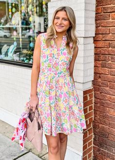 This Pastel Floral Vneck Dress is perfect for springtime. With a beautiful pastel floral print and a fun v-neck, this dress will instantly upgrade your look. It is fully lined for comfort and it's sure to be a go-to staple in your wardrobe. True to size Olivia is wearing small If between sizes or busty, size up V Neckline with faux button detail Ruffle detail at neckline and bottom hem Sleeveless - but bra friendly Zippered back closure Lined Side Pockets Fabric content: 100% Cotton Fabric has n Spring Floral Print V-neck Dress For Vacation, Floral Print V-neck Dress For Summer Brunch, Pink Floral Print V-neck Dress For Summer, Printed V-neck Spring Vacation Dress, Multicolor Printed Sundress For Spring, Spring V-neck Floral Dress For Brunch, Floral Print Sundress V-neck For Day Out, Spring V-neck Printed Sundress, Spring Printed V-neck Dress