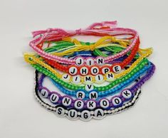 a bunch of bracelets with words on them