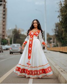 Description Immerse yourself in the allure of Ethiopian tradition with our "Scarlet Splendor" collection, showcasing the timeless beauty of red habesha dress. Each habesha kemis in this collection is a masterpiece, meticulously crafted to exude elegance and grace. The vibrant scarlet hue symbolizes passion and vitality, while the intricate details pay homage to Ethiopia's rich cultural heritage. Elevate your style with "Scarlet Splendor" and embrace the timeless charm of Ethiopian dress, where t Traditional Red Floor-length Dress, Traditional Red Maxi Length Dresses, Traditional Red Dresses For Eid, Traditional Red Maxi Dress For Wedding, Red Traditional Dress For Eid, Traditional Red Maxi Dress For Eid, Traditional Red Maxi Dress, Red Dress For Navratri Traditional Ceremonies, Red Dresses With Traditional Patterns For Ceremonies