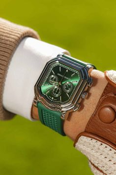 The Maestro 3.0 Chronograph is a one-to-one representation of the original Gérald Charles Genta’s drawings, with the the exception of the previously round pushers that are now taking on the asymmetric design of the Maestro case's shape. The stainless steel case features an emerald green sunburst dial with Super-LumiNova filled indices, and the matching vulcanized rubber strap is decorated with the Maison's signature Clous de Paris motif on the top side and the Gerald Charles logo tapisserie on the other. This timepiece has a 50 hour power reserve and is water resistant to 100 meters. Brand: Gerald CharlesModel: Maestro 3.0 ChronographReference Number: GC3.0-A-02Movement: AutomaticCase Material: Stainless SteelCase Size: 39mmDial: Emerald GreenBracelet/Strap: RubberGender: Men's Watch/Unise Luxury Green Chronograph Watch With Subdials, Luxury Green Watch With Rectangular Dial, Luxury Green Watch With Analog Display, Luxury Green Chronograph Watch With Analog Display, Luxury Green Watch For Business, Buccellati Jewelry, Fashion Earrings Studs, Parade Design, Laurent Ferrier