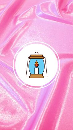 a pink background with a blue and white candle