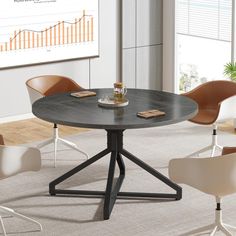 a round table with four chairs around it in an office setting on carpeted flooring