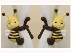 two stuffed animals made to look like bees