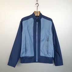 Beautiful vintage light jacket. 2 tones blue (light and navy). 80s/90s style, worker style. Zipped pockets hidden in a box pleat, very cool! Workwear & sportswear, very stylish. MATERIALS & CONDITION Material is 65% polyester, 35% cotton with 100% nylon lining. Condition is : very very good vintage condition -- only small light dark traces on the front, see last photo MEASUREMENTS Size is M (refer to measurements and photos with model) Do not hesitate to DM if you have any questions ! Shoulder s Sporty Blue Windbreaker With Zipper Closure, Casual Blue Windbreaker With Zipper, Casual Blue Windbreaker With Zipper Closure, Retro Blue Track Jacket With Pockets, Blue Cotton Windbreaker With Pockets, Blue Windbreaker With Zipper Closure For Outdoor, Blue Windbreaker With Zipper For Outdoor, Casual Blue Track Jacket With Zipper Closure, Sporty Blue Outerwear With Zip Fly