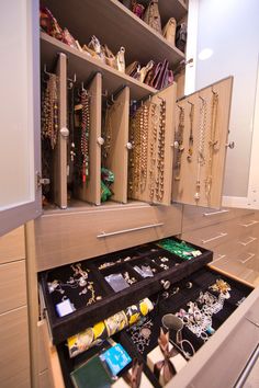 an image of a woman's dream walk in closet with lots of jewelry inside