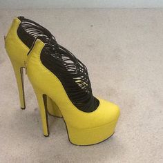 Yellow High Heel Platforms Yellow Platform Heels For Party, Yellow Synthetic Heels With 4-inch Heel, Yellow 4-inch Heel Synthetic Heels, Yellow Closed Toe Evening Heels, Yellow Platform High Heels, Yellow Closed Toe Platform Heels, Yellow Round Toe Heels For Evening, Yellow Closed Toe Heels In Synthetic Material, Yellow Synthetic Closed Toe Heels