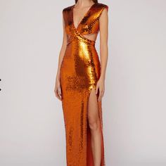 Long Dress With V-Neck At The Front And Back, Characterized By A Particular Interwoven Bodice With Small Holes On The Hips. Special Features Of The Garment Are The All-Over Embroidered Sequins, Which Create An Elegant Play Of Light And Shadow. The Textured Shoulders And Sensual Slit Decorate The Dress. The Style Is That Of The Party Or A Ceremony. Sku:73ajo486n0158511 Materials And Care Made Entirely In Italy. Composition: 90%Polyester, 10%Elastam. Dry Clean In A Specialist Center. Size 40 Itali Phoenix Inspired Gown, Nye Dress, Sequin Formal Dress, Glam Dresses, Silver Dress, Orange Dress, Light And Shadow, Sequin Dress, Holiday Party