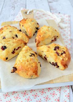 six scones sitting on top of a piece of parchment paper