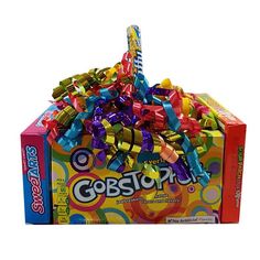 a box filled with colorful candy sticks