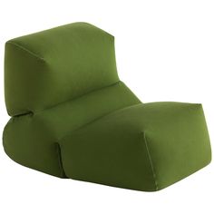 a green chair that is sitting up against a white background with the seat cushion down