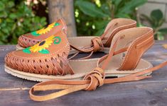 Womens brown sunflower embroidered leather closed toe lace up flat mexican sandals Brown Lace-up Sandals With Leather Sole For Spring, Brown Huarache Sandals With Leather Sole For Summer, Brown Lace-up Sandals With Round Toe For Spring, Brown Huarache Sandals With Woven Sole For Spring, Brown Slip-on Huarache Sandals For Summer, Slip-on Huarache Sandals For Spring Vacation, Spring Festival Sandals With Leather Sole, Summer Huarache Sandals With Rubber Sole, Spring Festival Adjustable Huarache Sandals