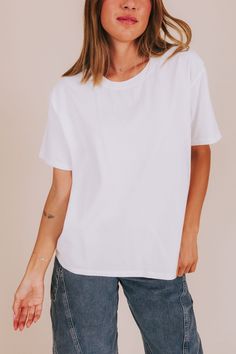 The Blinded Top: a basic white tee that's perfect for any occasion! Comfy enough for a casual day out, yet versatile enough to dress up or down. A must-have for any wardrobe. Details Crew neckline Basic tee Boxy fit Sizing Approximate measurements: SIZE LENGTH BUST Small 25" 44" Medium 26" 46.5" Large 26.5" 50" Fabric has some stretchModel is 5'8" wearing small Material 100% Cotton Hand wash coldDo not bleachHang dry Do not iron Trendy Plain T-shirt For Everyday, White Casual T-shirt With Shirttail Hem, Casual White T-shirt With Shirttail Hem, Spring T-shirt For Casual Gatherings With Shirttail Hem, Spring Casual T-shirt With Shirttail Hem, Relaxed Fit Short Sleeve Top, Spring T-shirt With Shirttail Hem For Everyday Wear, Trendy Relaxed Fit Short Sleeve Top For Everyday, Basic White T-shirt For Everyday