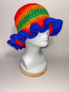 Add a splash of color to your outfit with our Burnt Rainbow Frill Bucket Hat! This unique accessory features a delightful blend of earthy rainbow hues, complemented by a charming frilly brim that adds a touch of whimsy to your look. Features: *Unique Design: Burnt rainbow colors for a vibrant and earthy aesthetic. *Charming Frill: A frilly brim that adds a playful and feminine touch. *Summer-Ready: Lightweight and breathable material ensures you stay cool and comfortable. *Sun Protection: Brim p Trendy Adjustable Multicolor Hats, Multicolor Short Brim Hat For Spring, Playful Multicolor Wide Brim Sun Hat, Trendy Multicolor Bucket Hat For Spring, Trendy Multicolor Hat For Festivals, Trendy Multicolor Festival Hat, Fun Multicolor Bucket Hat For Spring, Adjustable Multicolor Sun Hat For Spring, Multicolor Bucket Hat For Spring